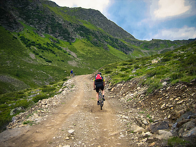 man riding bicycle cycling on mountainside thumbnail