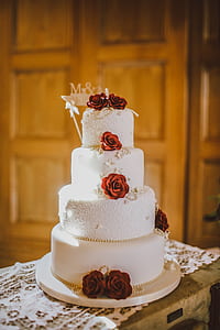 4-tier cake with red flower accent thumbnail