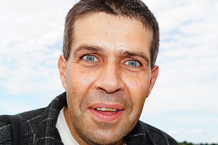 man smiling in front of camera thumbnail