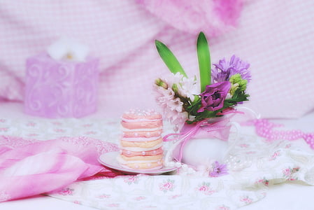 white and purple petaled flowers and round macaroons thumbnail