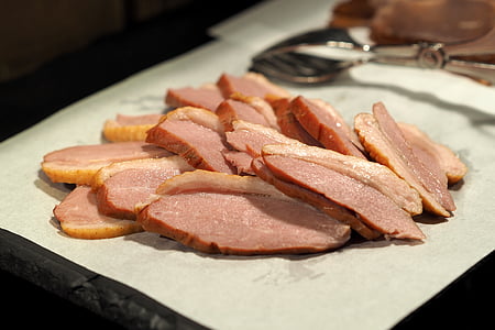 sliced meat on grey surface thumbnail