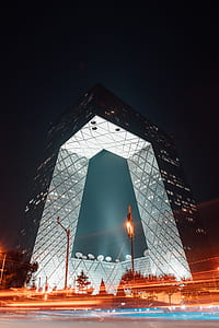 grey high-rise building during nighttime thumbnail