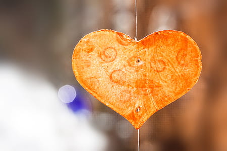 selective focus photography of decorative yellow and orange heart thumbnail
