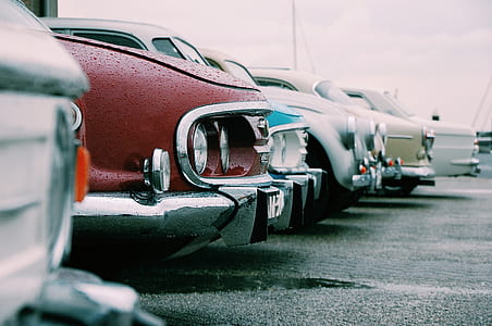 assorted-color vehicle parking on ground thumbnail