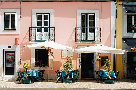 three blue outdoor dining table set with umbrellas thumbnail