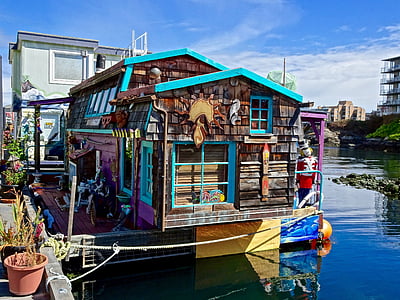 teal, brown, and pink wooden house thumbnail