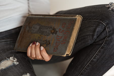 Beautiful young woman reading a book thumbnail