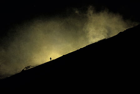 person walking towards mountain thumbnail