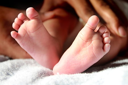 baby on white fleece textile thumbnail