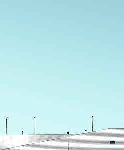 skies and street lights during daytime thumbnail