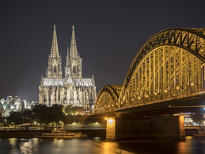 lighted bridge beside body of water thumbnail