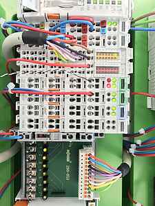 multicolored wires plugged in white machine thumbnail
