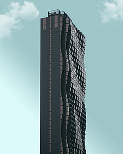 photo of black and gray curved high-rise building thumbnail
