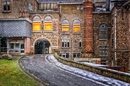 roadway near concrete building during daytime thumbnail