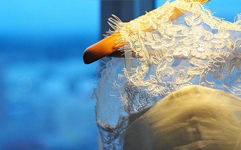 focus photography of white lace sleeveless top thumbnail