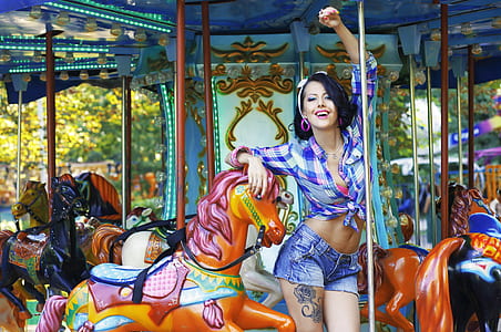 woman in purple plaid long-sleeved button-up shirt on carousel thumbnail