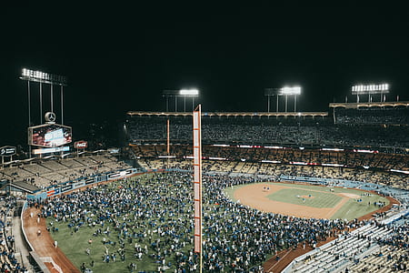 people in baseball stadium during nighttime thumbnail