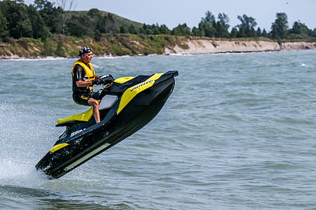 man riding personal watercraft thumbnail