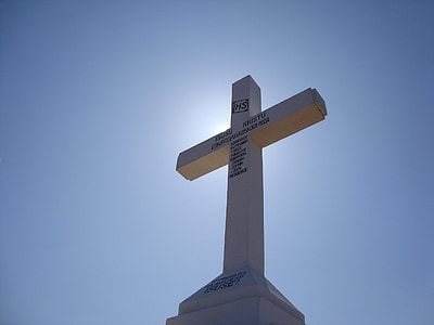 white cross monument at daytime thumbnail