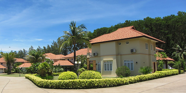 white and red concrete house during daytime thumbnail
