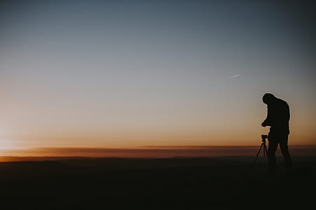 silhouette of a man during sunset thumbnail