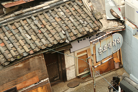 top view photography of brown wooden house with brown tiled roof thumbnail
