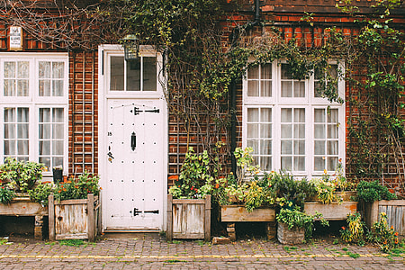 brown brick house with white wooden door thumbnail