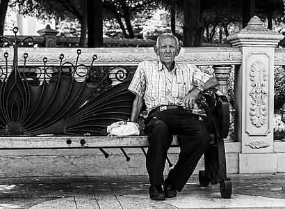 man sitting on bench on park thumbnail