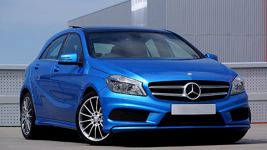 blue Mercedes-Benz sedan parked outside thumbnail