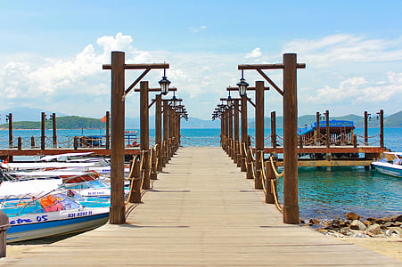 brown wooden yatch dock during daytime thumbnail