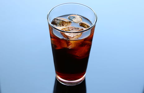 brown liquid in clear drinking glas thumbnail