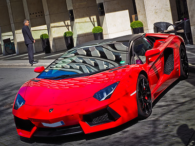 red Lamborghini Aventador coupe on road thumbnail