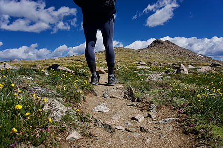 person standing on road under blue sky thumbnail