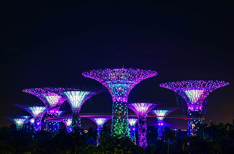 purple LED towers during night time thumbnail