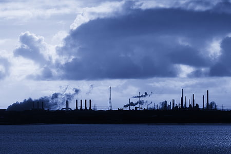 silhouette of towers under cloudy sky during daytime thumbnail