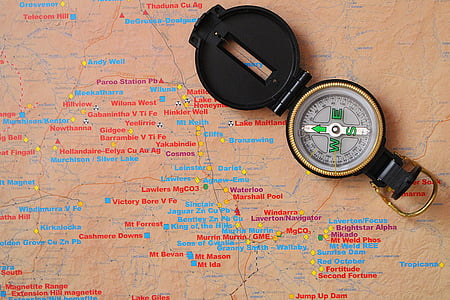 white compass on map thumbnail