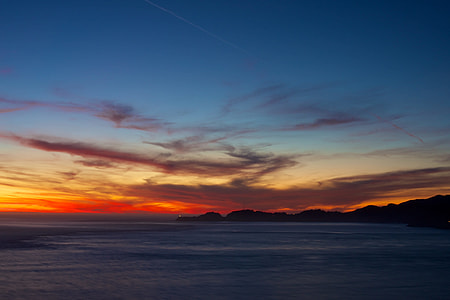 silhouette of island during golden hour thumbnail