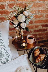 A lovely woman's bedroom with a beautiful bouquet of flowers thumbnail