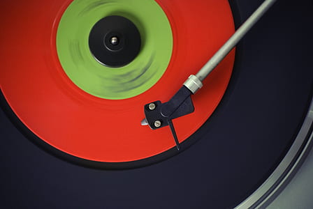 macro photography of black and red vinyl record thumbnail