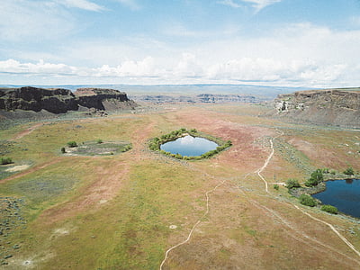 aerial view photography of mountain under white sky thumbnail