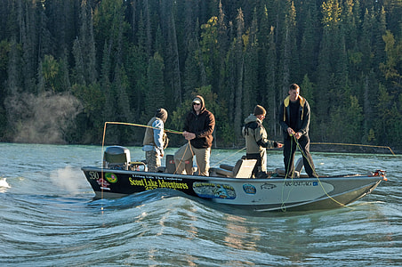 men riding on boat while fishing during daytime thumbnail
