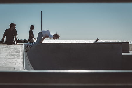 person riding on skateboard while on half pipe thumbnail