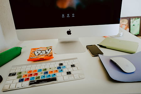 silver iMac with Apple magic mouse on desk thumbnail