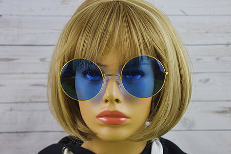 closeup photo of mannequin wearing blonde wig and sunglasses thumbnail