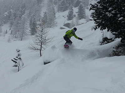 man riding on snowboard thumbnail