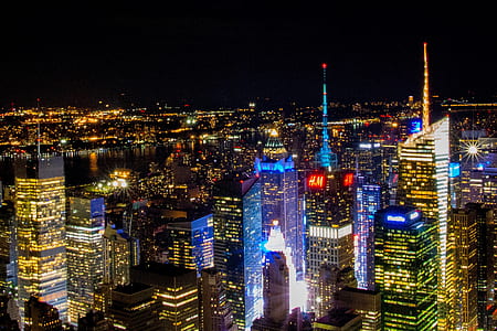 aerial shot of high-rise buildings with lights during nighttime thumbnail