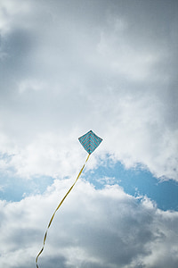 blue and yellow kite at daytime thumbnail