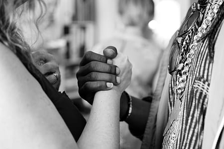 grayscale photo of two person holding hands thumbnail