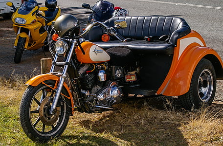 orange trike on road thumbnail