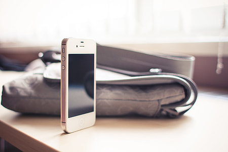 White iPhone 4S standing on the Desk thumbnail